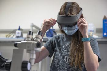 Maureen Hayden in the lab wearing her Acesight device