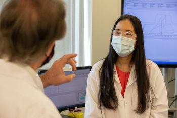 Sharp visiting with a female research scientist
