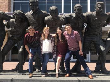The Mendoza family sawin' it off in front of the War Hymn statue