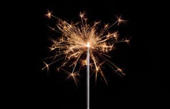 Close up of a sparkler against a dark background