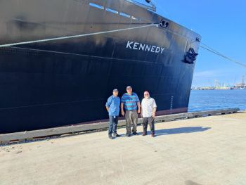 L-R Chef Marc Cruz, Prof Milton Korn and Rabbi Yossi Lazaroff standing before the USTS Kennedy