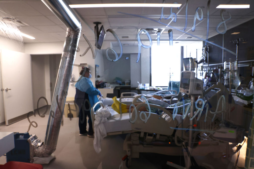 view through a window into an icu unit in a hospital