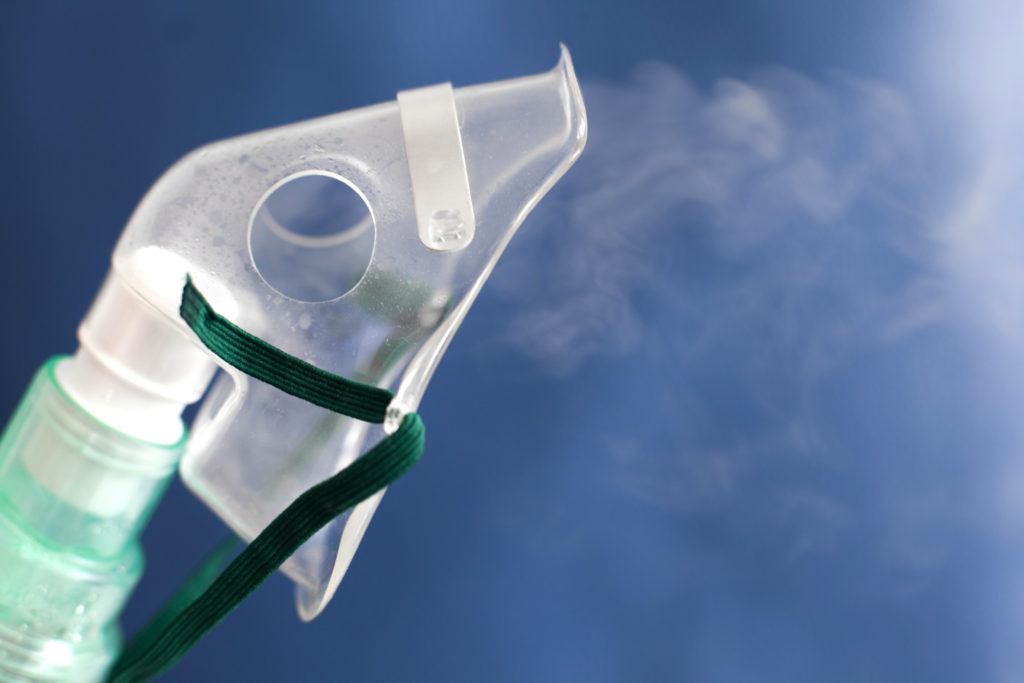 oxygen mask against blue background