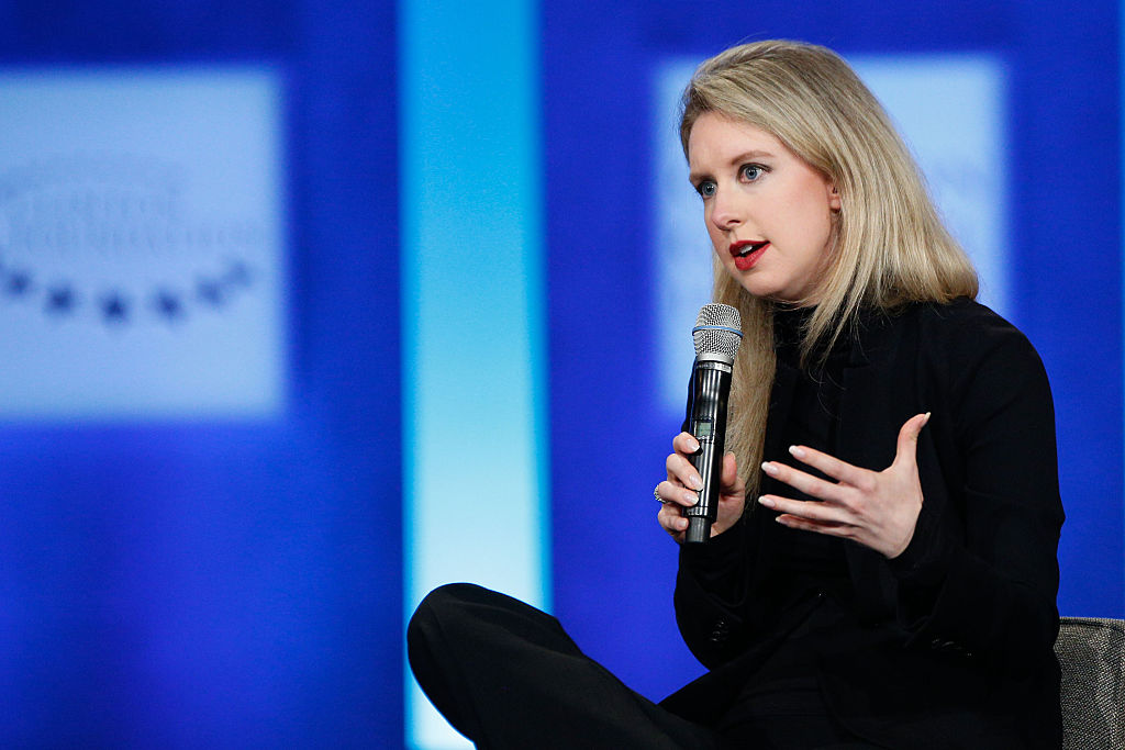 elizabeth holmes speaking on a stage