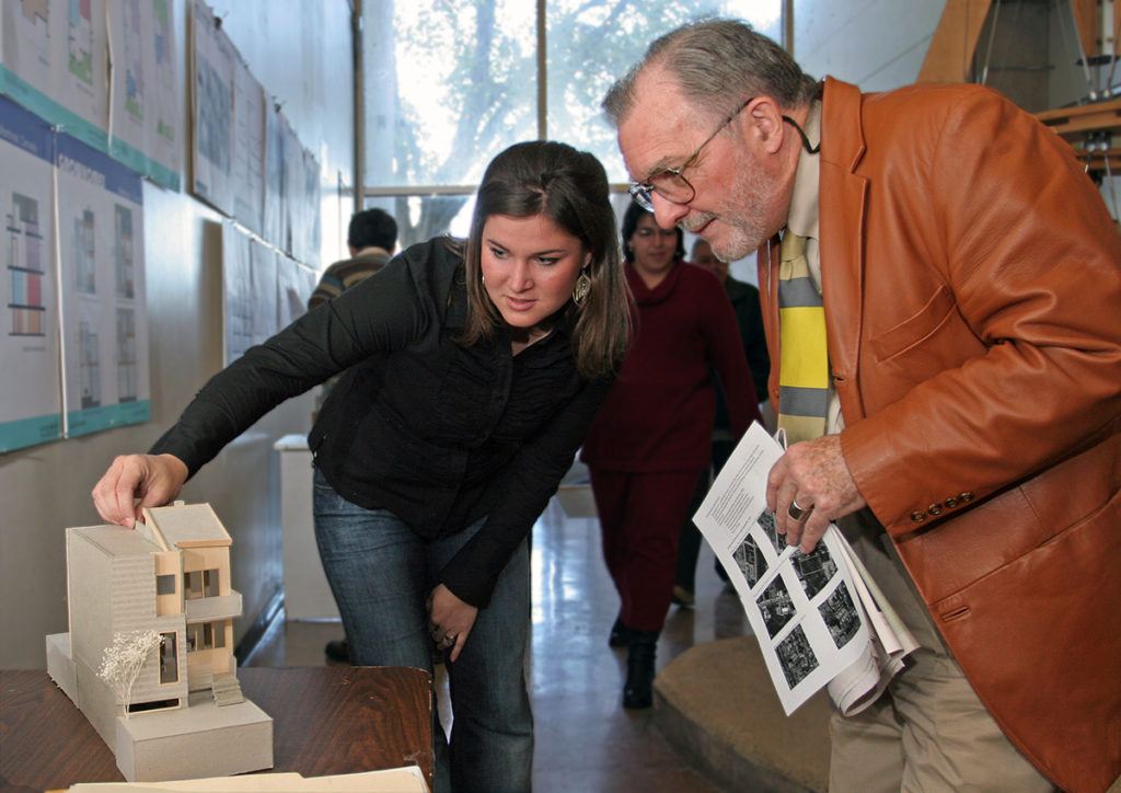 Rodney Hill looking at a project with a student