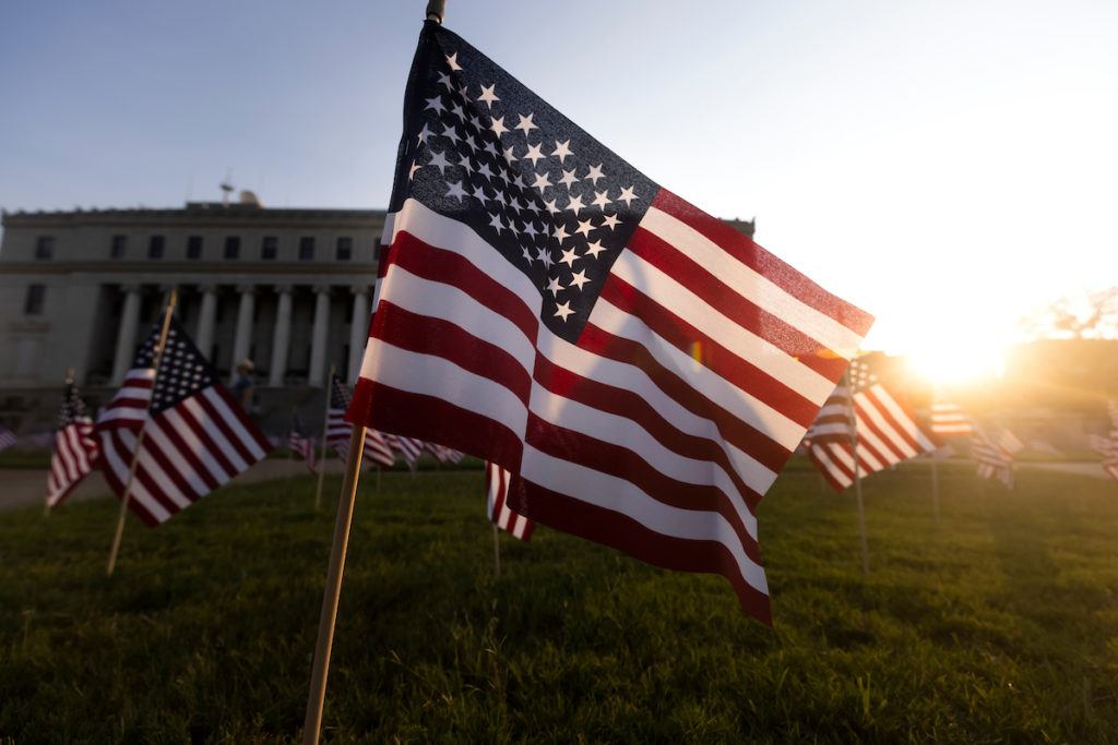american flags in front of the administration building