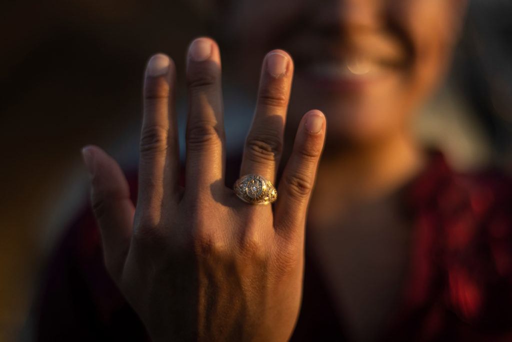 close up of rodriguez's hand showing aggie ring on her finger