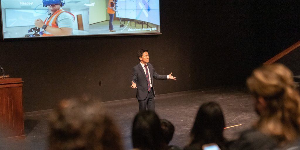 nam kim presenting on stage