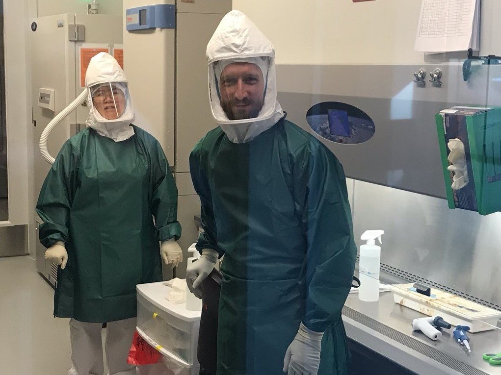 two researchers standing in a lab