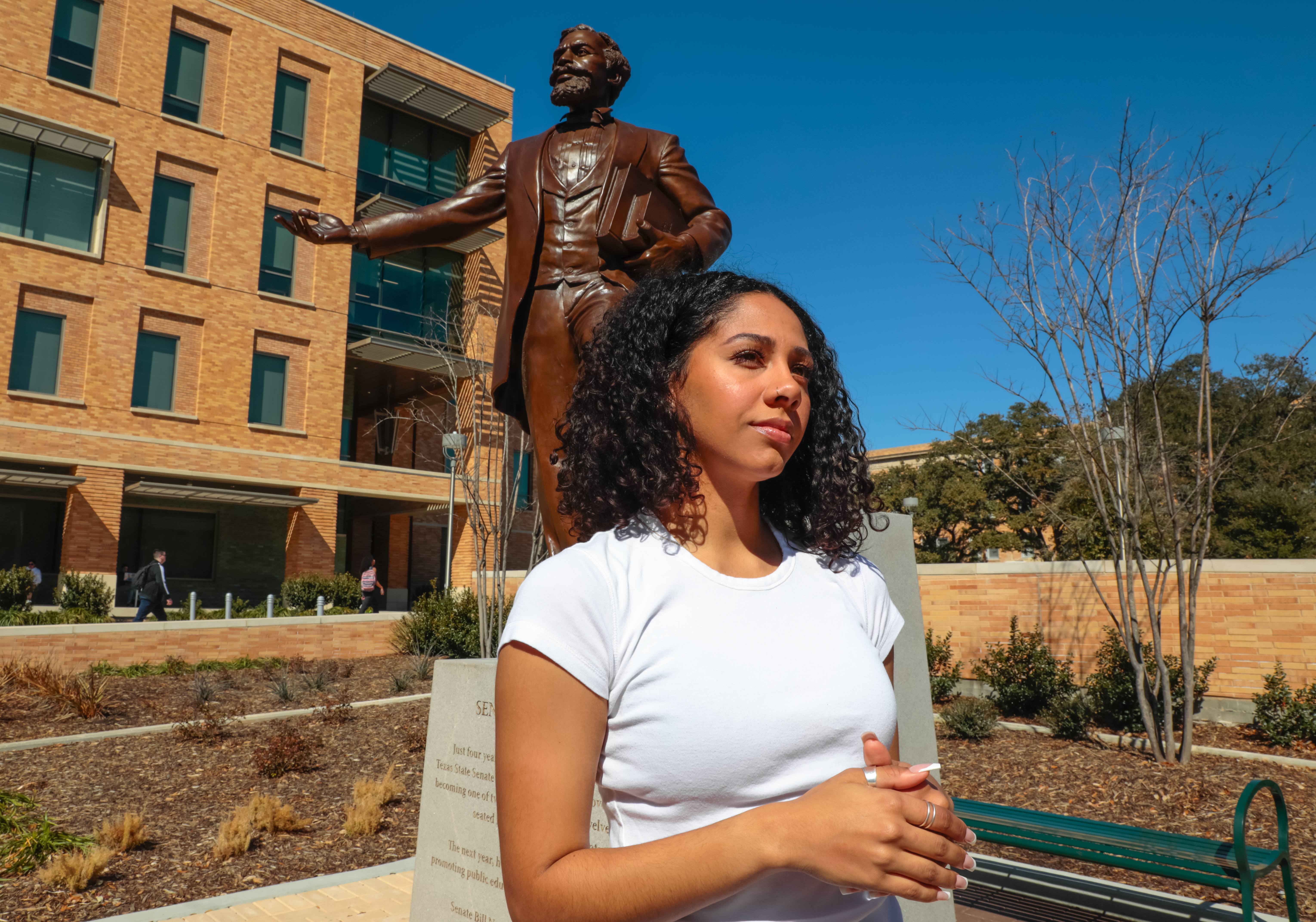 mason alexander-hawk stands in front of the statue of matthew gaines