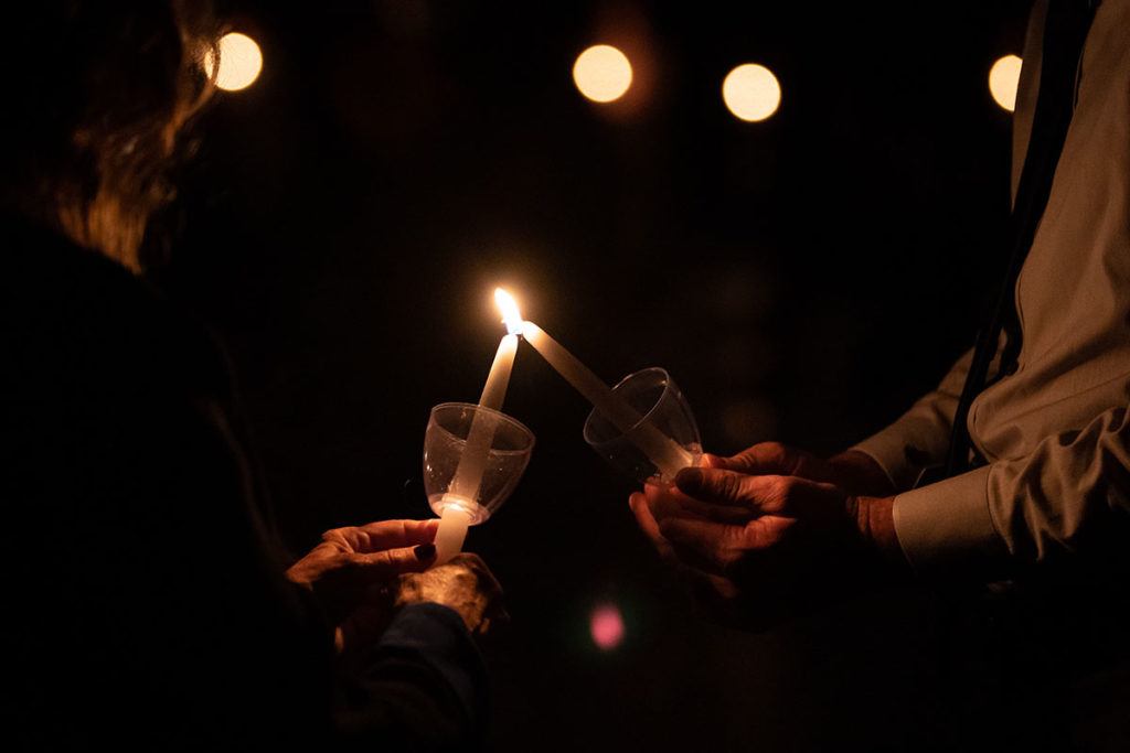 candles being lit at Muster