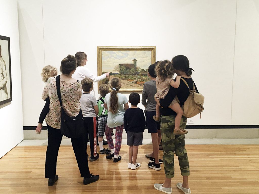 a group of visitors in the galleries
