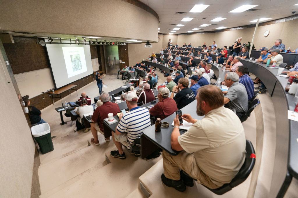 wide angle view of people sitting in a teaching theater