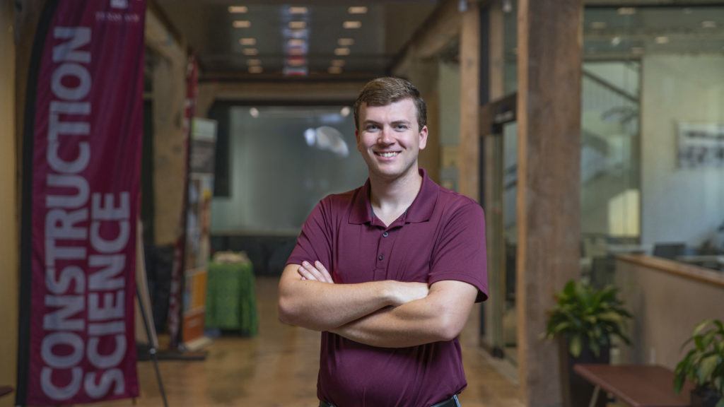portrait of student standing with arms crossed