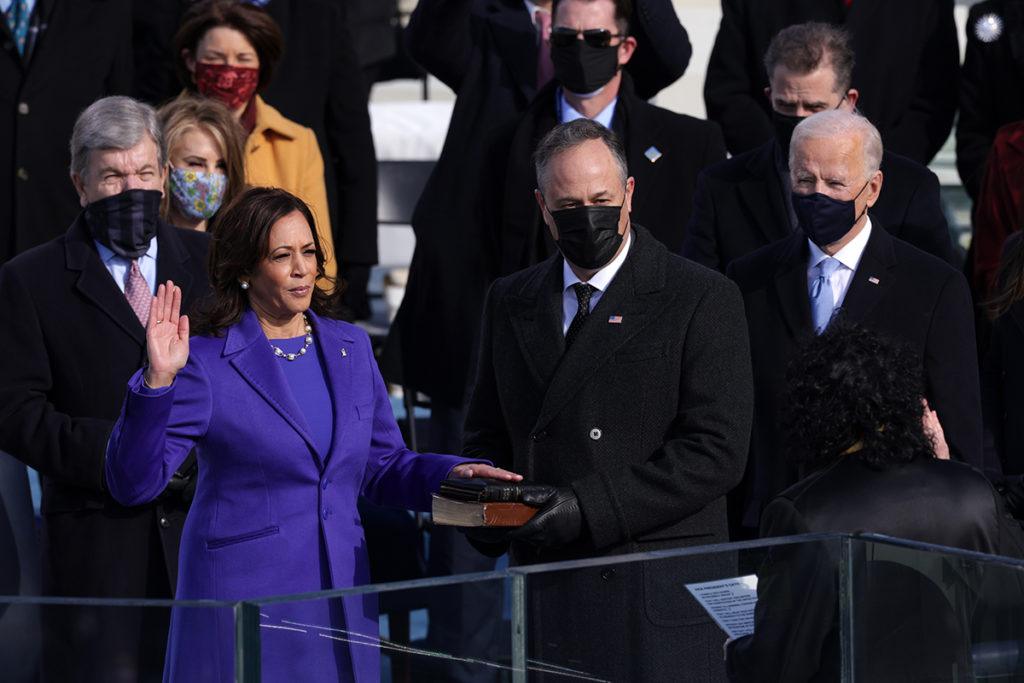 Kamala Harris is sworn in as U.S. Vice President as her husband Doug Emhoff looks on