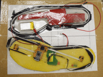 a photo of "smart insoles" containing various wires and circuitboards.