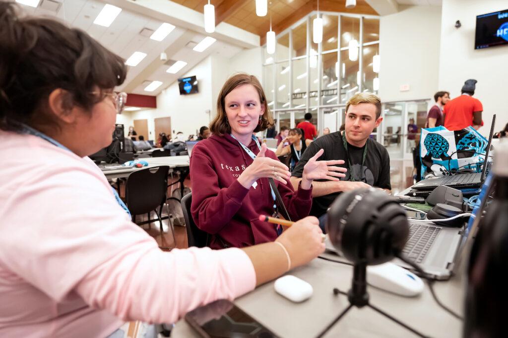 Three college students discuss creating a game at the Chillennium game jam.
