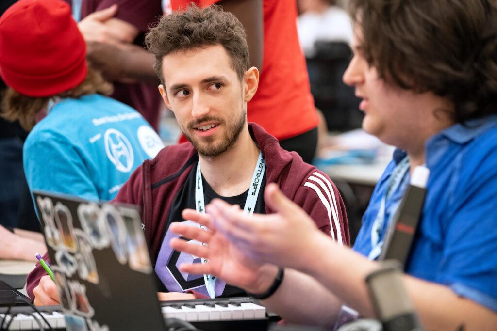 Two college students discuss creating a game at the Chillennium game jam.
