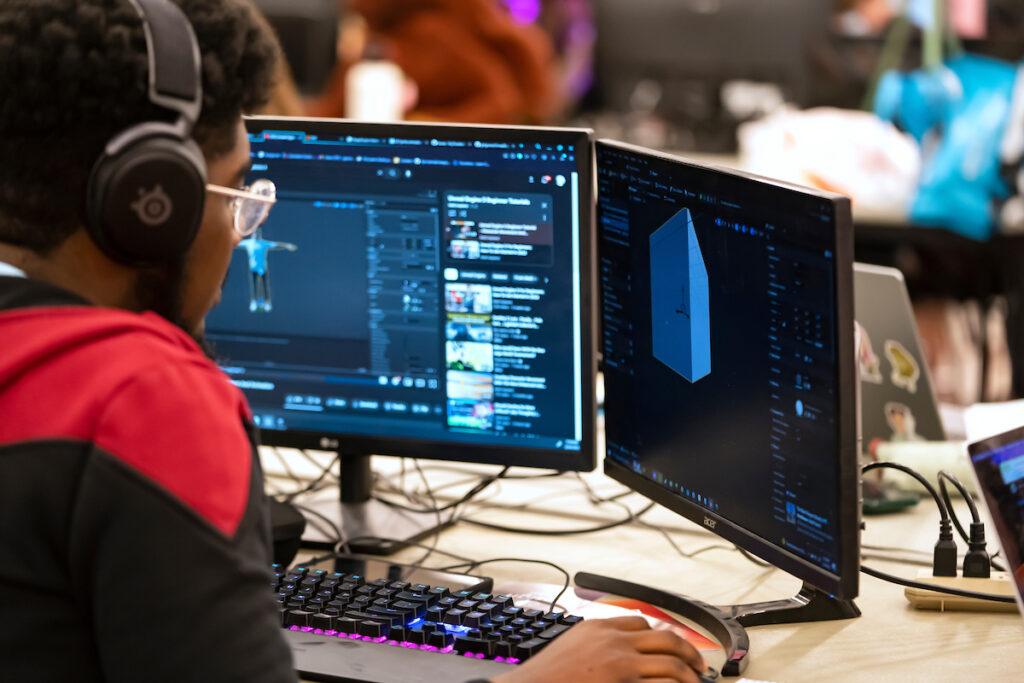 A college student works on creating a video game at the Chillennium game jam.