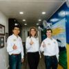 BUILD Chief Operating Officer Chase Parrish '24, Chief Financial Officer Albert Tran '24 and Chief Executive Officer Kate-Riley Rogers stand inside of the Ukraine TAMC