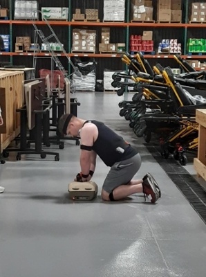 a man wearing the device simulating CPR
