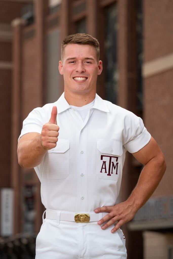 portrait of head yell leader trevor yelton outside kyle field