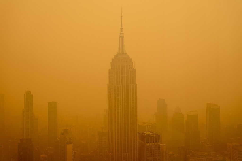 Smoky haze from wildfires in Canada diminishes the visibility of the Empire State Building