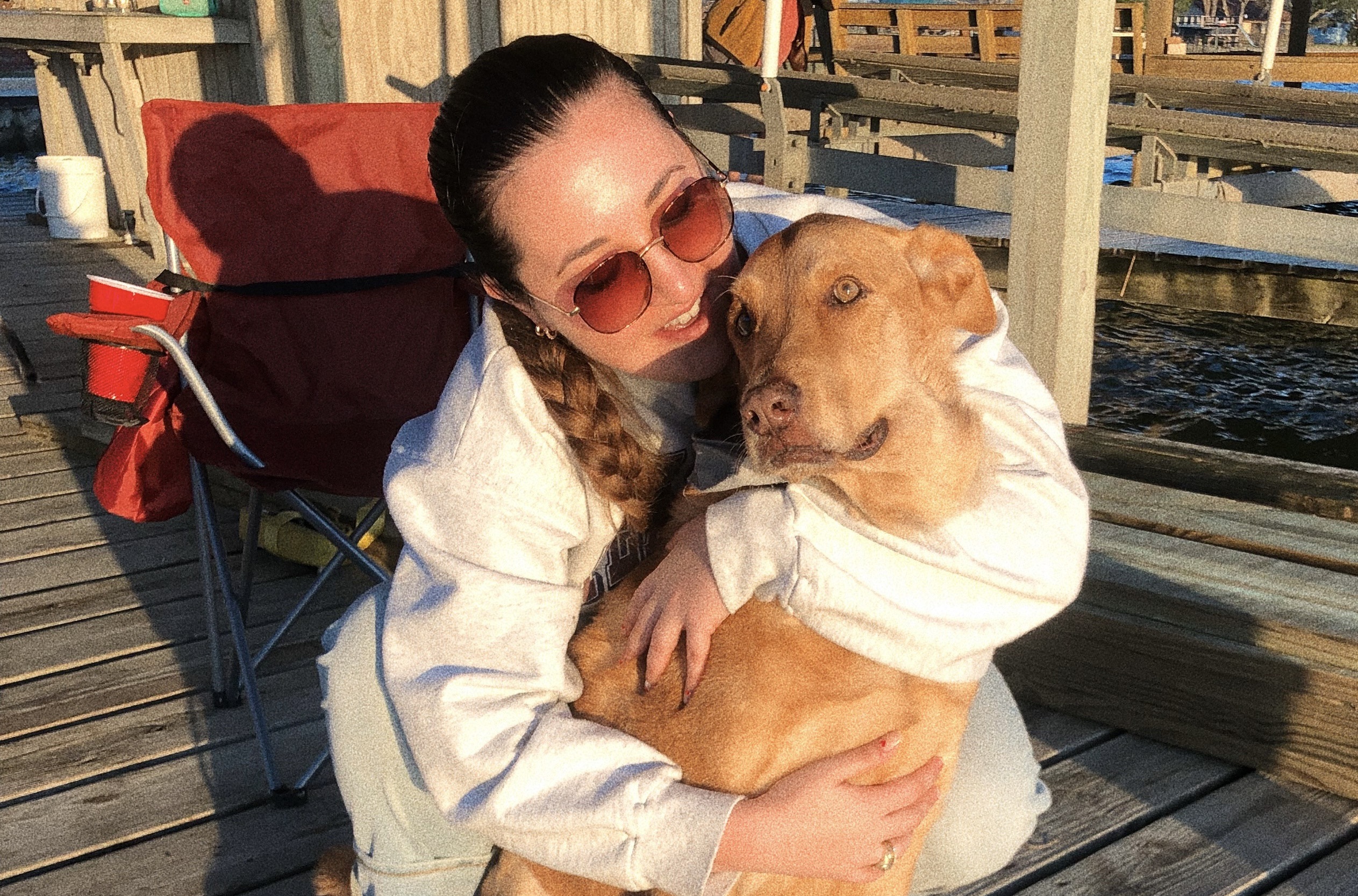 Jake the dog and his owner Josie hugging