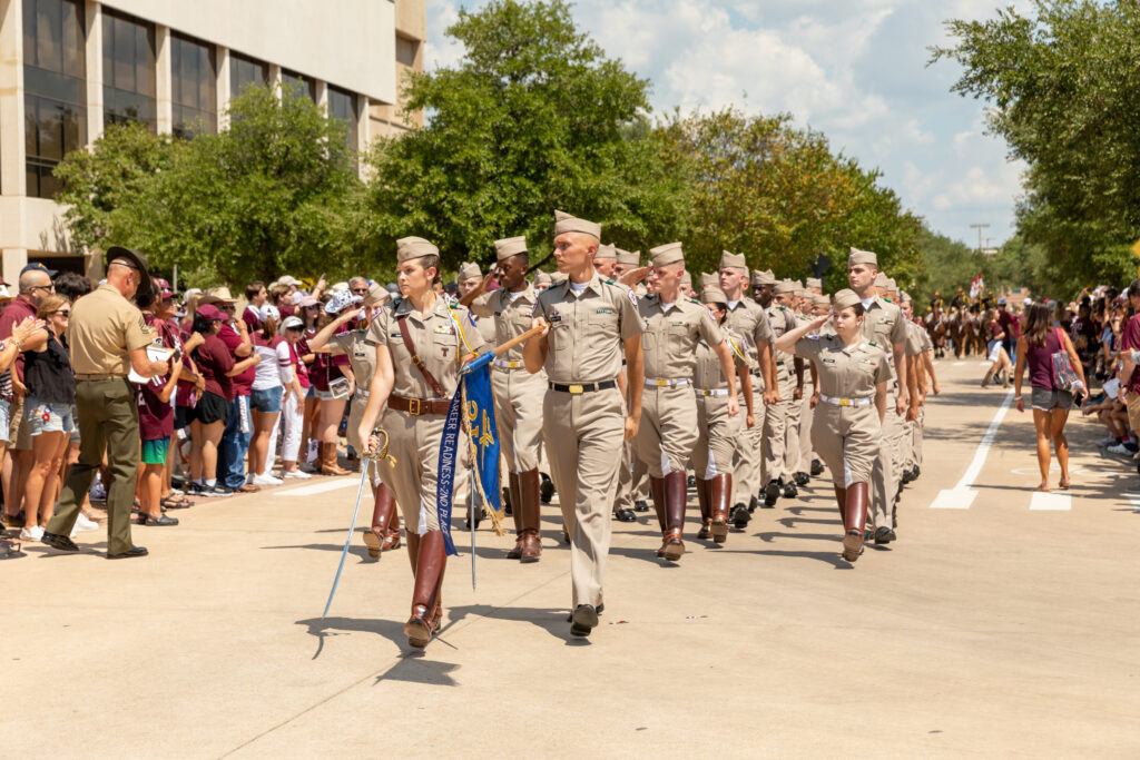a photo of cadets marching on campus.