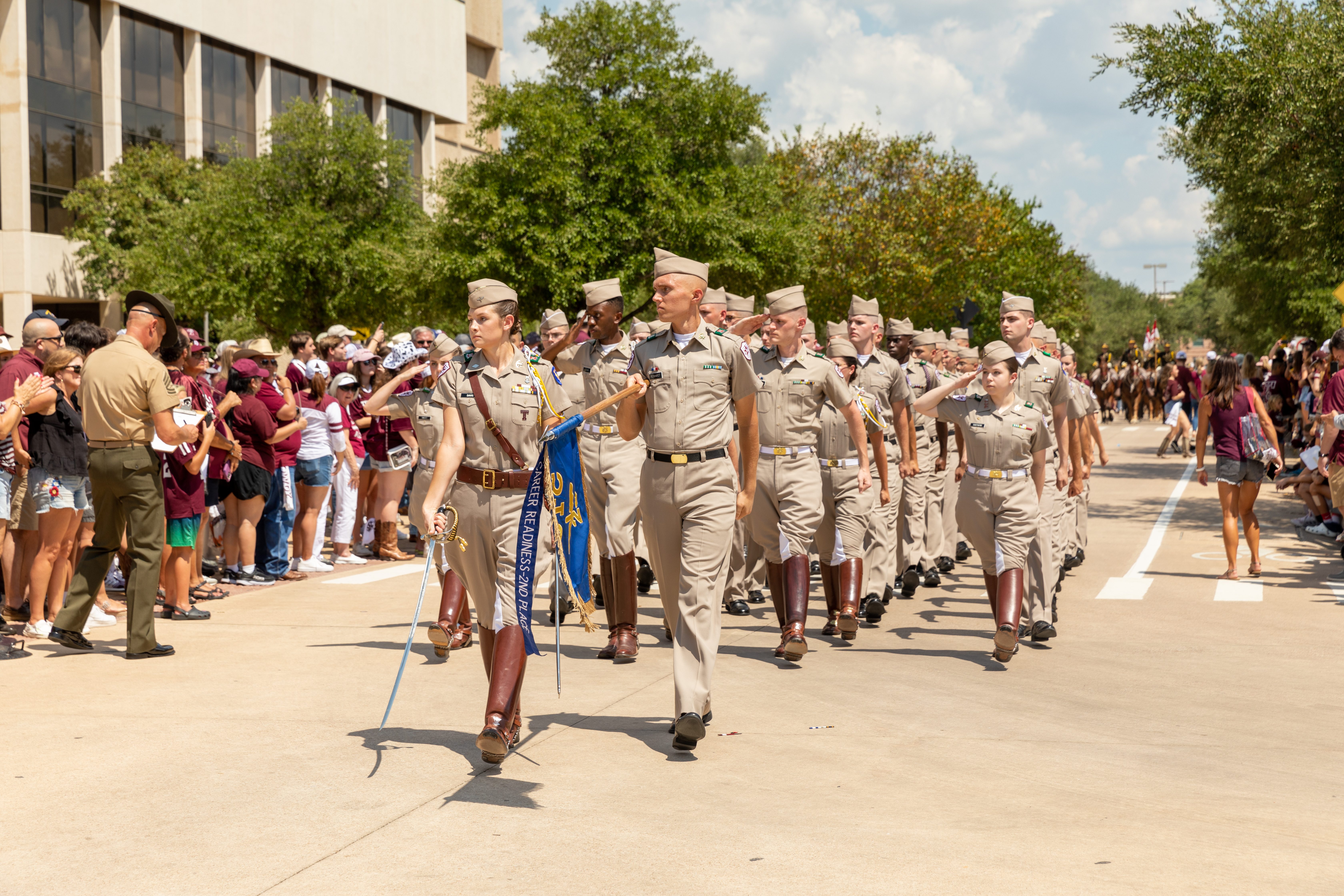 a photo of cadets marching on campus.