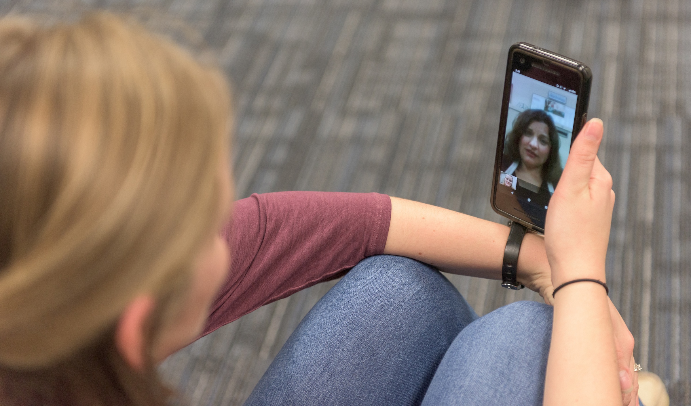 photo illustration of a woman talking to a health care provider on her cell phone
