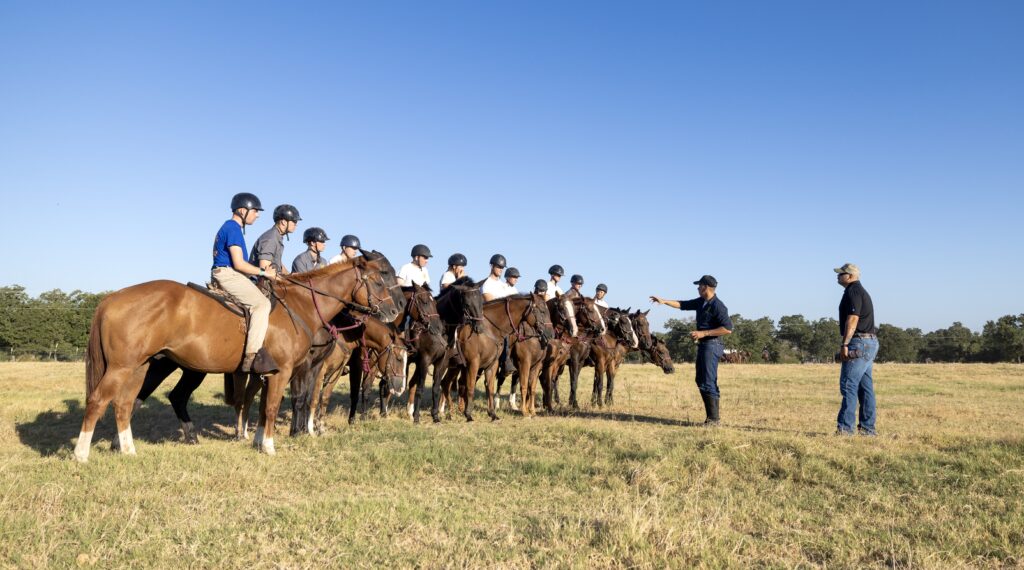 A photo of cadets in the Parsons Mounted Cavalry on horseback.