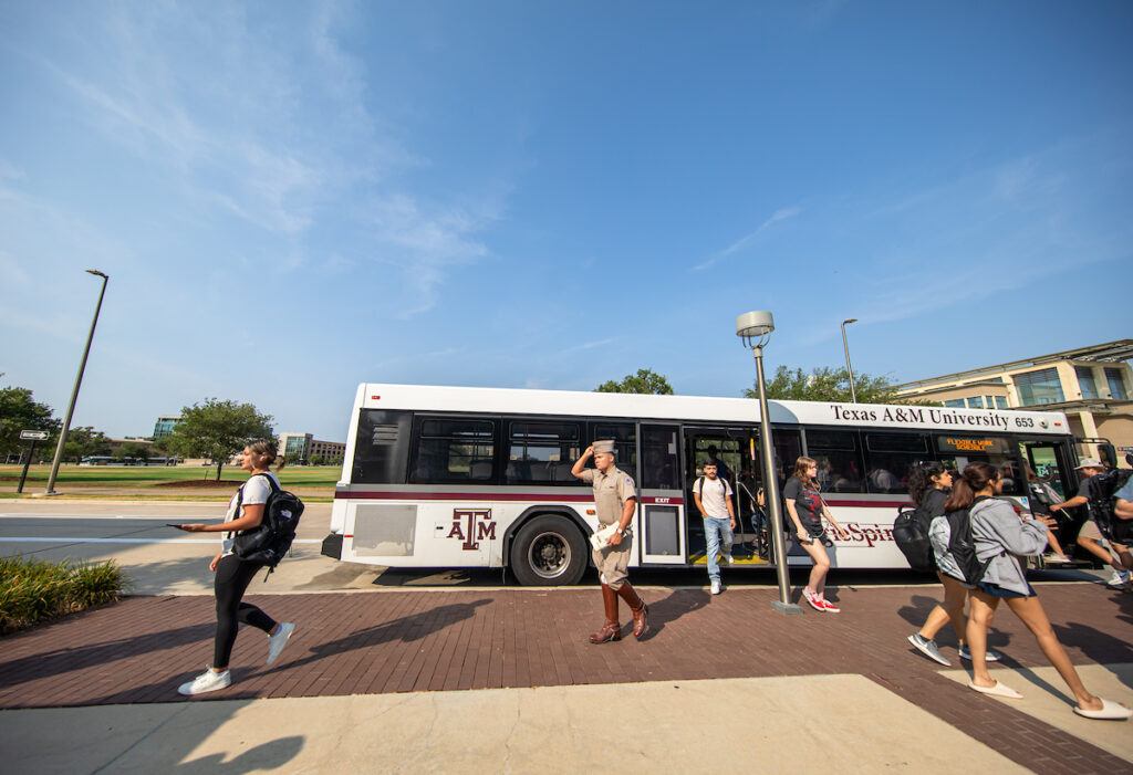 Students ride the Aggie Spirit bus