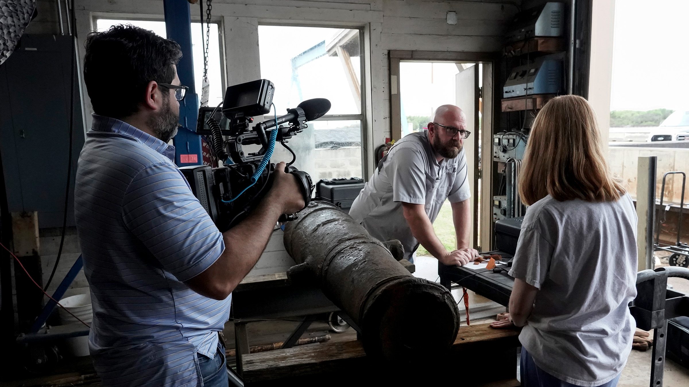 a photo of Dr. Christopher Dostal, Conservation Research Lab, with Texas A&M Today crew members