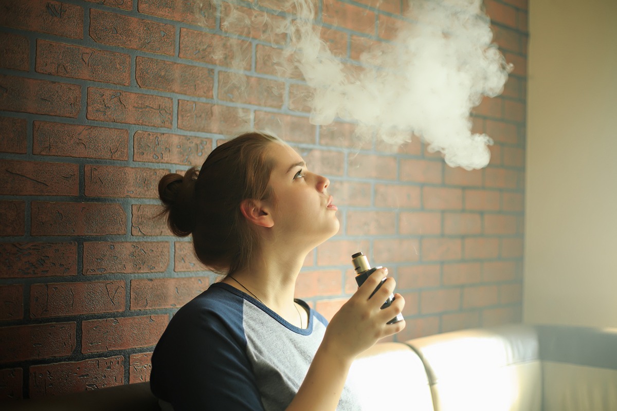 a teenager vaping