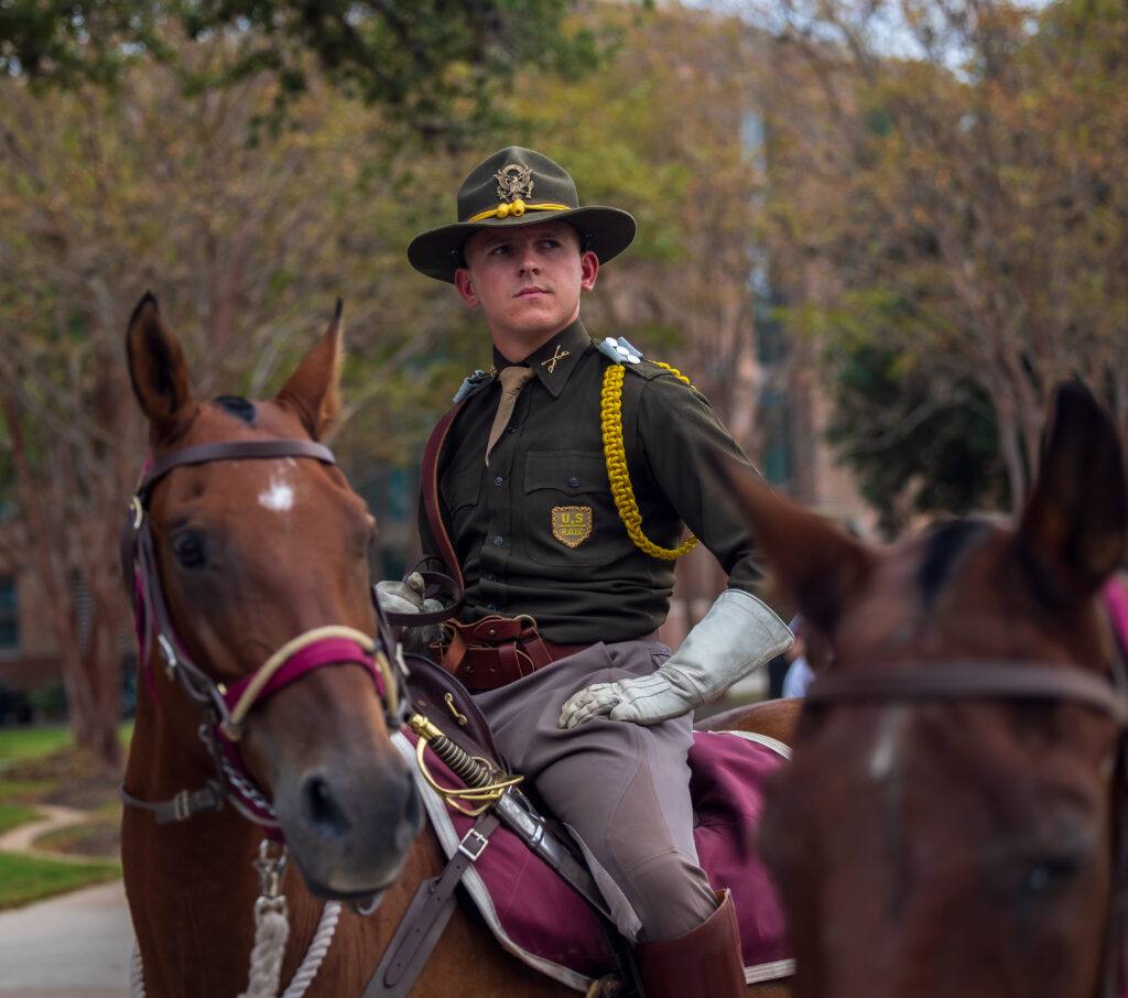 A photo of a Texas A&M student on horseback