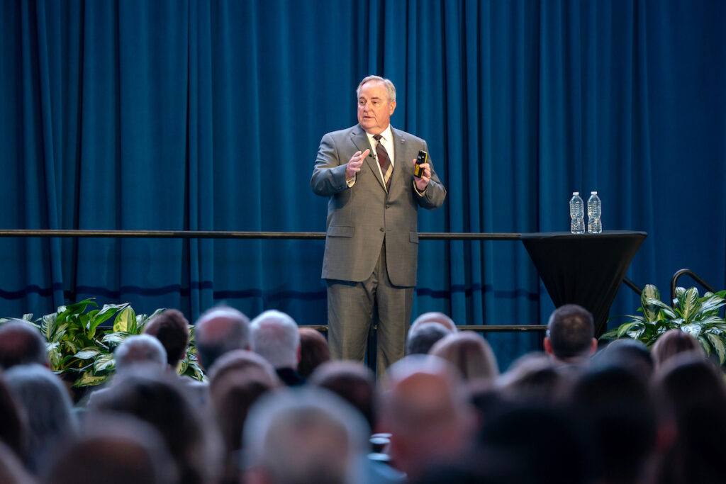 Welsh speaking on stage in front of an audience