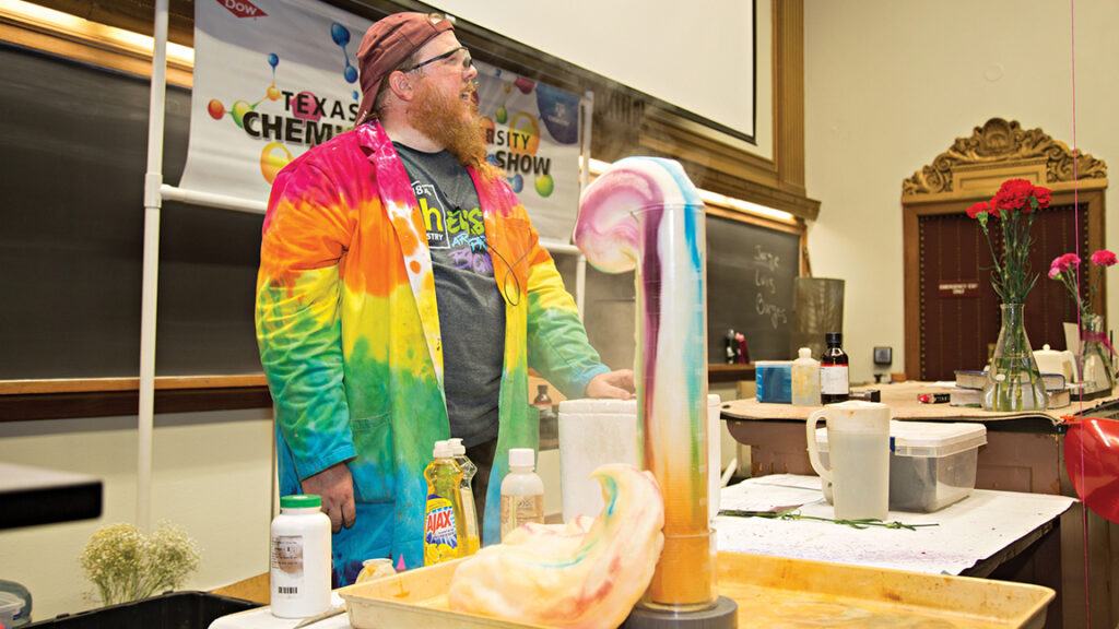 A Chemistry Road Show staff member shows off an experiment.