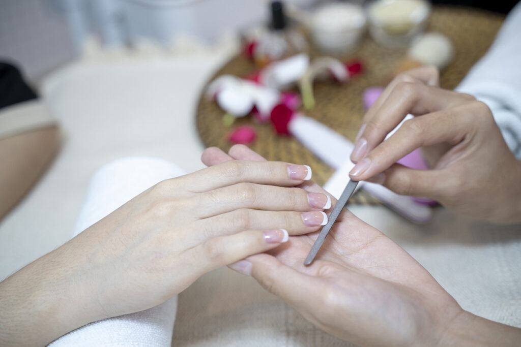 a manicure being done at a nail salon