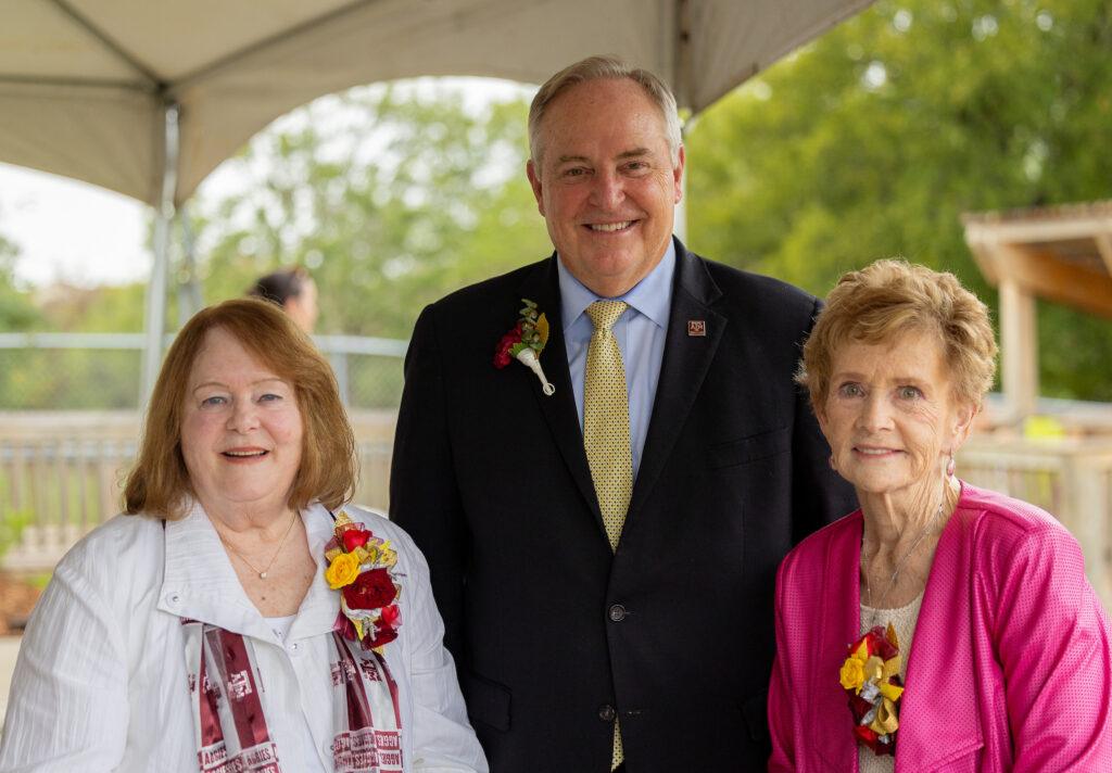 Becky Gates, Mark Welsh and Dorothy McFerrin stand outside together