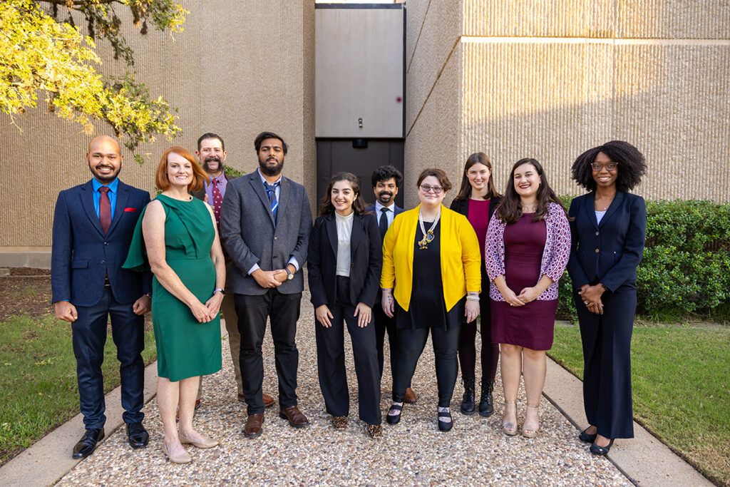 This year's 3MT finalists pose together outside the venue