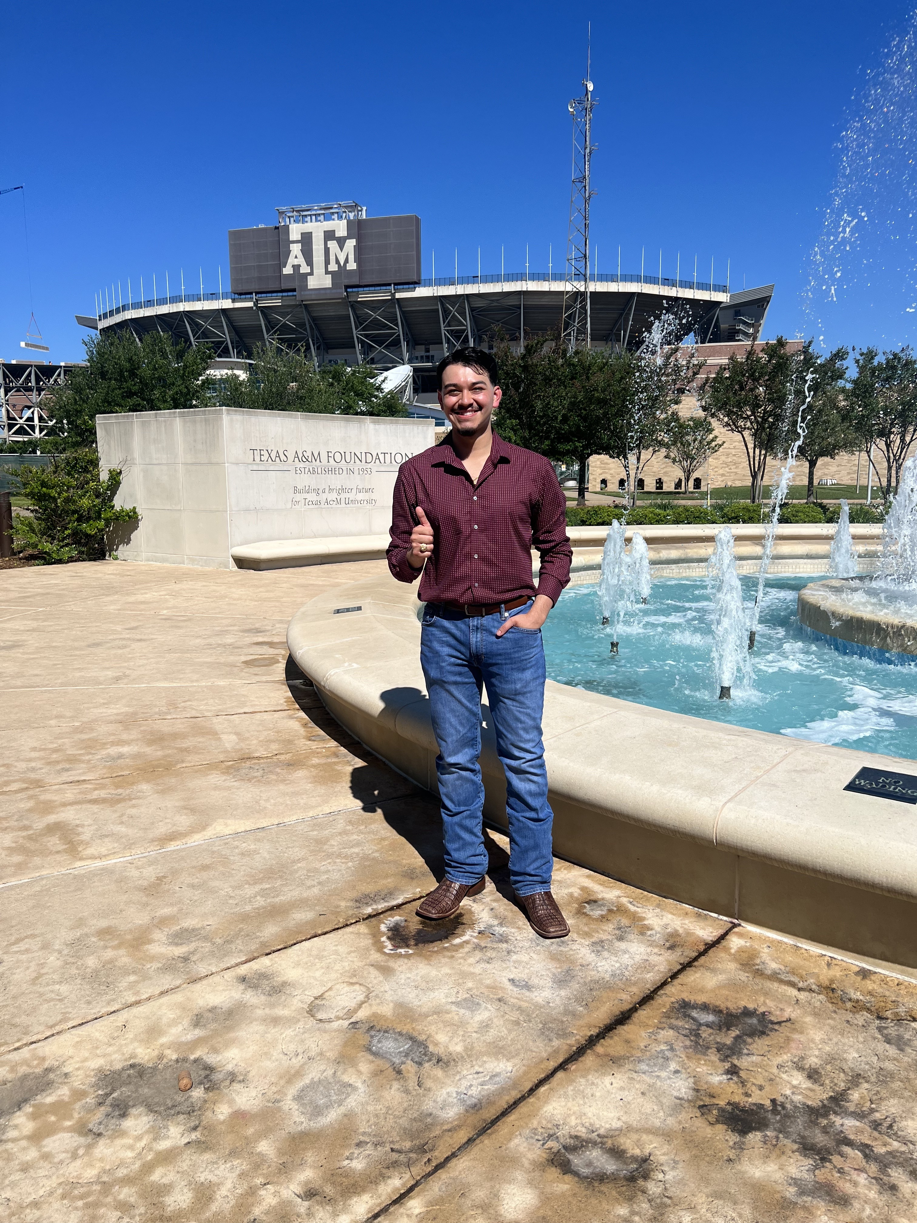 Jordy Villatoro at the Texas A&M Foundation fountain