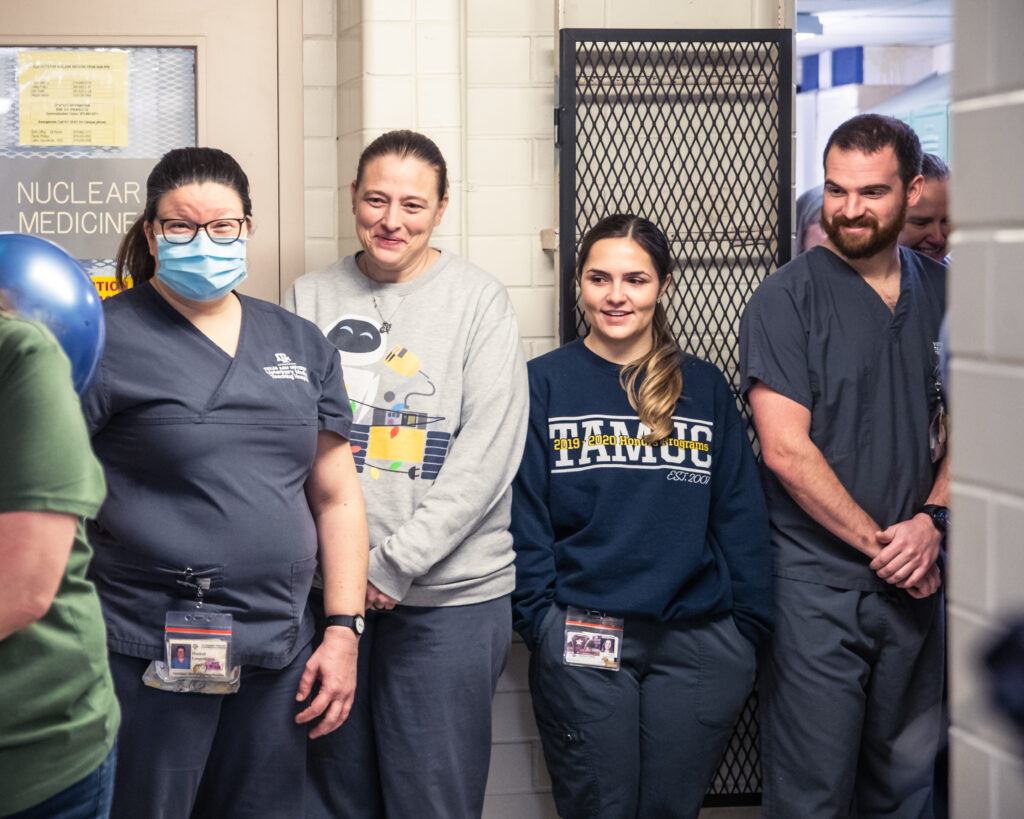 vet techs being surprised with their new wellness space