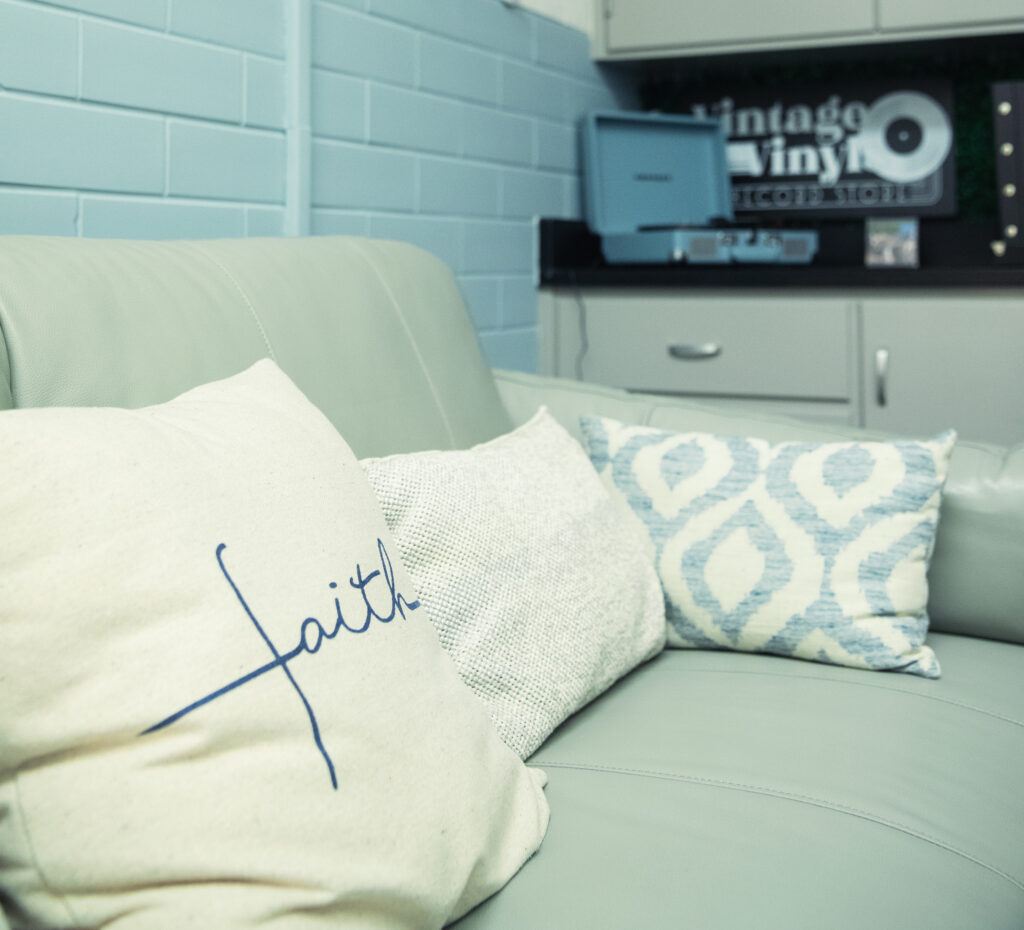 the wellness space at Vet Med with a couch and "vinyl corner" with