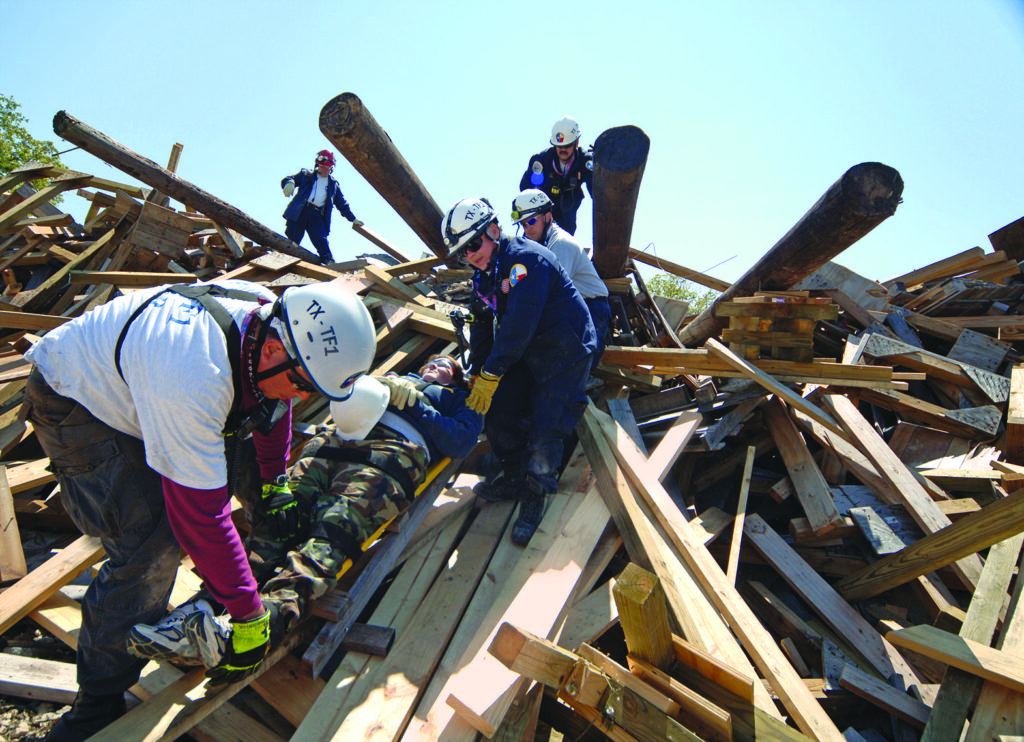 trainees in a simulated building collapse