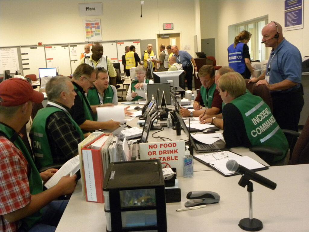 trainees sitting in a simulated incident command center running an exercise
