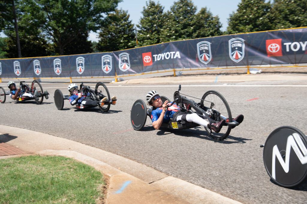 A photo of ahtletes competing in a paralympic cycling event.