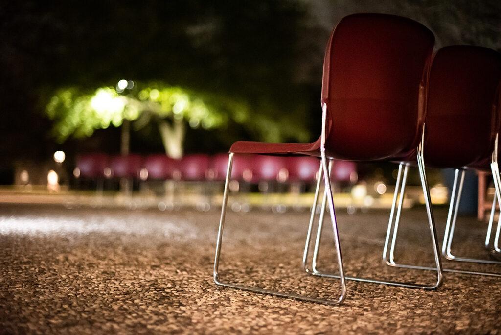 Chairs for the families are placed at the center of the plaza in the early evening by university staff and removed late at night.