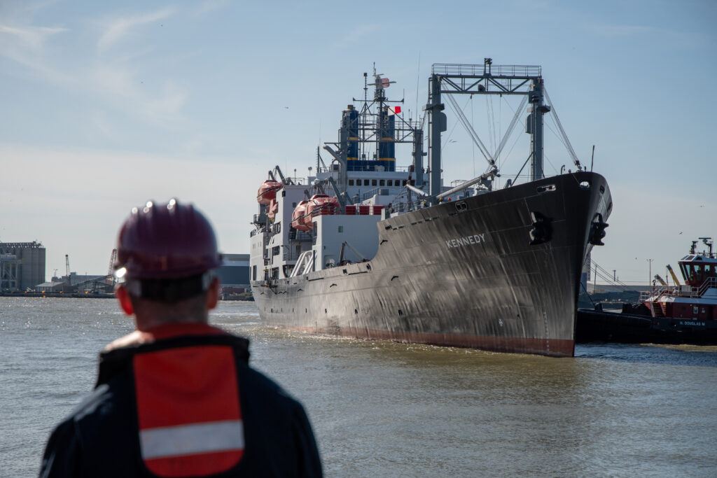 TS Kennedy with a person looking at it
