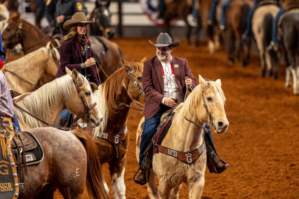 Ahdieh on horseback on the arena floor at the Fort Worth Stock Show and Rodeo.
